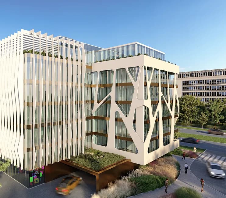 White sculpted commercial building on a street corner