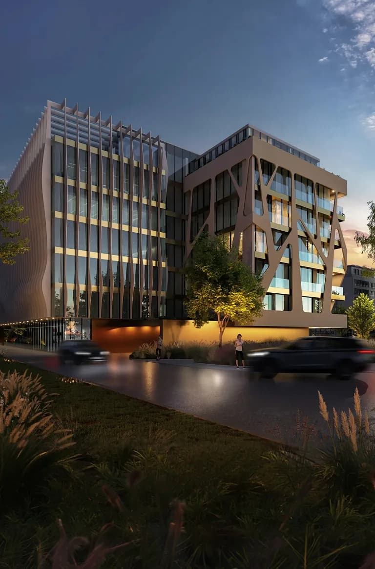 Contemporary office building facade lit at dusk