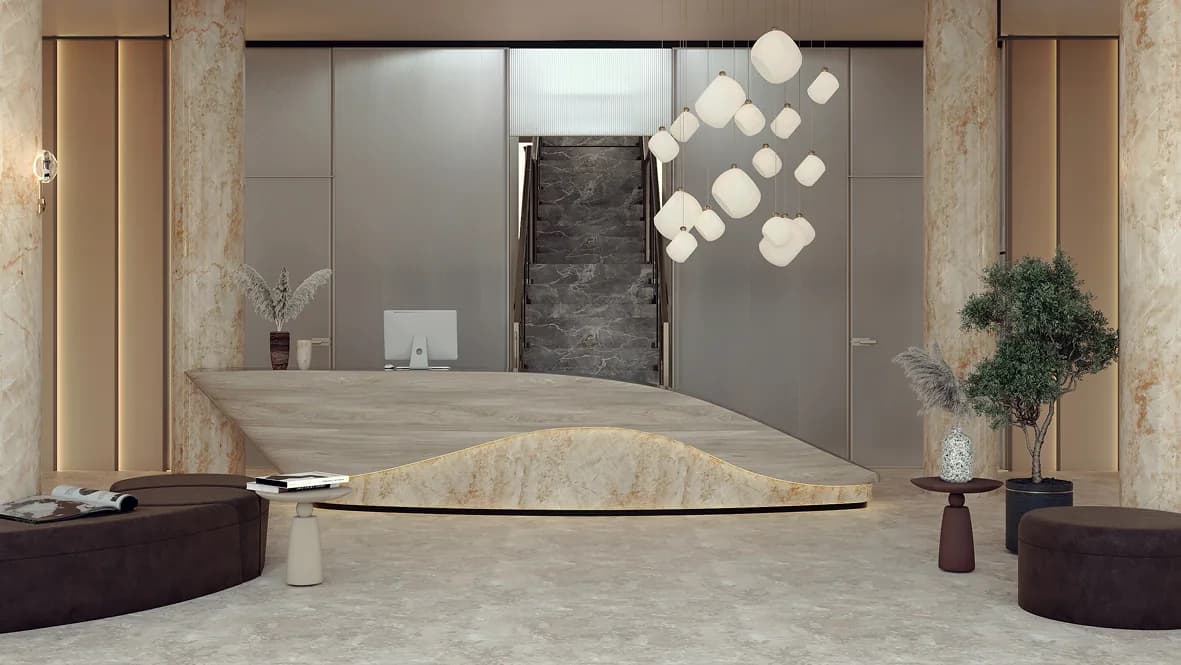 Calm reception lobby with a marble desk and sculptural lighting